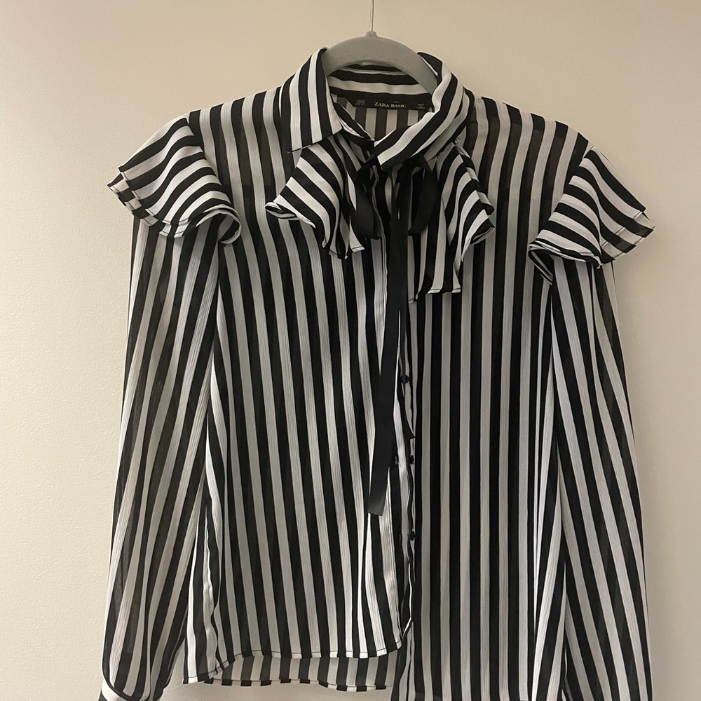 Black and White stripped blouse with ruffle and ribbon tie.